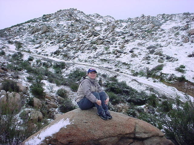 Carrie on a rock, freezing her A$$ off