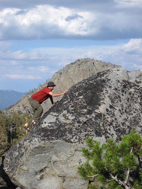 Mickey's climbing up rocks