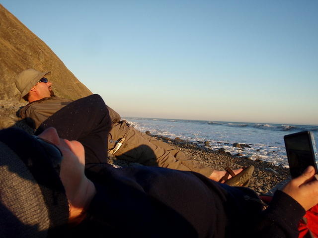 Relaxing & watching the waves while waiting for the sun to set.