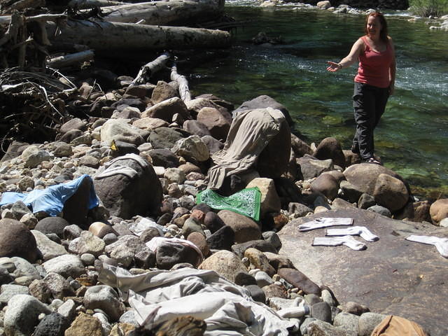 Our laundry is laying out to dry after we "washed" them in the river. (NO soaps allowed)