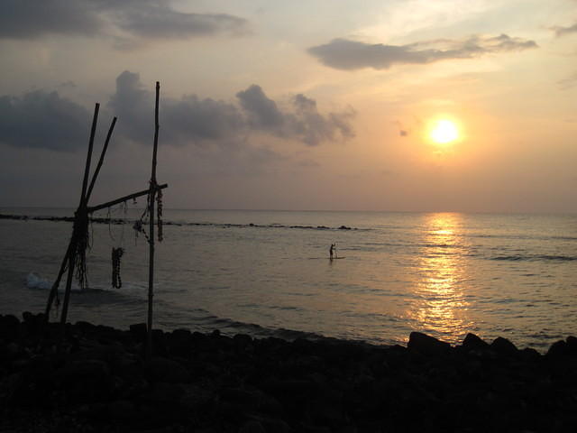 Sunset at the Hawaiian temple Ku'emanu Heiau.  The Hawaiian come pray for gnarly surfing conditions.