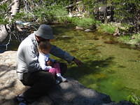 Uncle Mickey teaching Erin about the outdoors