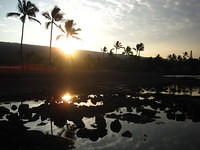 The Sun rising over the tidepools near our condo.