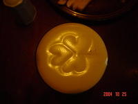 A shamrock imprinted into the foamy head of Guinness