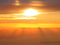 View of the sun setting from inside the plane