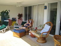 Carrie reading on the porch