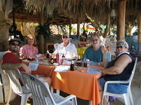 Enjoying ceviche de camarones, empanadas, y cervezas.